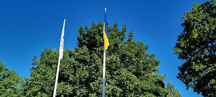 Ukraine flag next to the university flag 